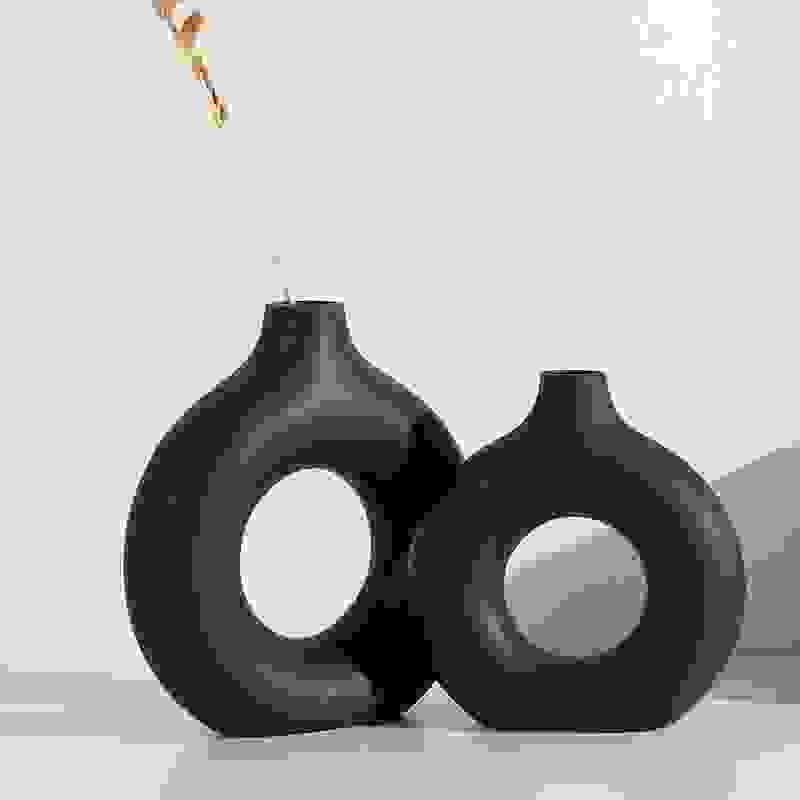 Set of two black NordicBloom™ Elegant Flower Vases Decorative Display, showcasing modern circular design for stylish home decor.
