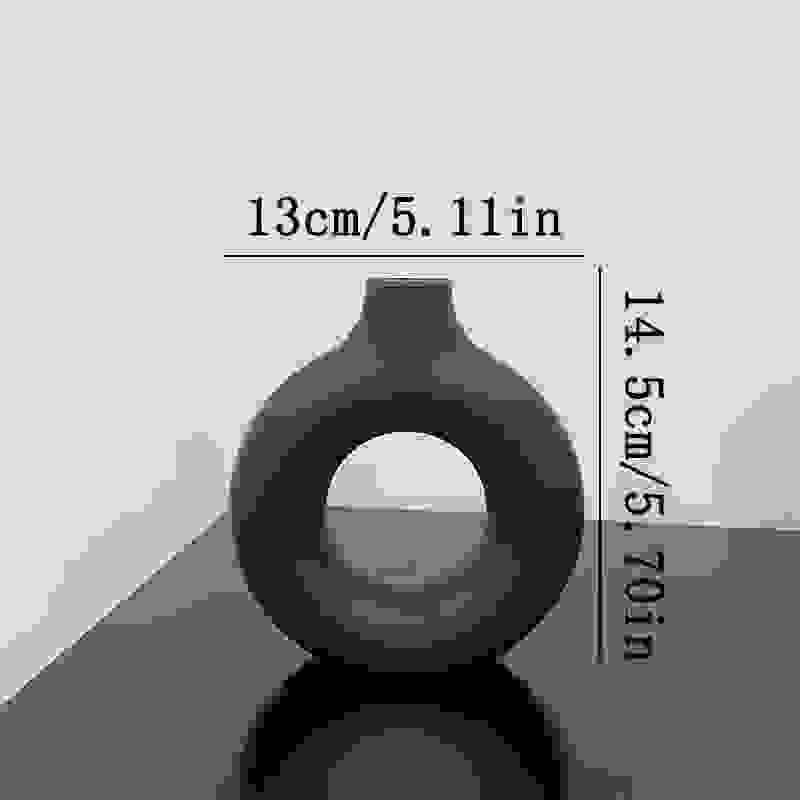 Small black NordicBloom™ Elegant Flower Vase Decorative Display, 14.5cm tall and 13cm wide, ideal for minimalist decor accents.